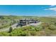Stunning luxury home on hillside with outdoor living space and fire pit at 3520 Castle Butte Dr, Castle Rock, CO 80109
