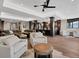 Spacious living room with a large leather sofa, bar, and comfortable seating area at 3520 Castle Butte Dr, Castle Rock, CO 80109