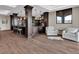 A comfortable living area with a built in bar, hardwood floors and mountain views at 3520 Castle Butte Dr, Castle Rock, CO 80109