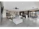 Spacious living area blending seamlessly with a modern kitchen at 3520 Castle Butte Dr, Castle Rock, CO 80109