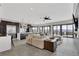 Open concept living room with stone floors and lots of natural light at 3520 Castle Butte Dr, Castle Rock, CO 80109