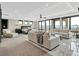 A luxurious main bedroom with a sitting area, plush carpet, and large windows with stunning views at 3520 Castle Butte Dr, Castle Rock, CO 80109