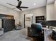 Comfortable office space features large windows, tile floor, ceiling fan, and built-in shelving at 3520 Castle Butte Dr, Castle Rock, CO 80109