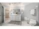 Spacious bathroom featuring a double vanity with marble counters, tiled floors, and modern lighting at 1625 Larimer St # 2601, Denver, CO 80202