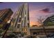 Exterior view of the high-rise building at sunset, highlighting its architectural design and urban location at 1625 Larimer St # 2601, Denver, CO 80202