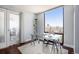 Bright office space with a glass desk, hardwood floors, and stunning city views at 1625 Larimer St # 2601, Denver, CO 80202