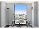 Bright office space with a glass desk, hardwood floors, and stunning city views at 1625 Larimer St # 2601, Denver, CO 80202
