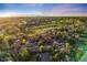 Scenic aerial view of a community near a golf course with mountain views at sunset at 2777 S Elmira St # 17, Denver, CO 80231