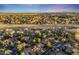 Aerial view showing homes nestled beside green spaces and a winding stream at 2777 S Elmira St # 17, Denver, CO 80231