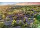 Scenic aerial view of homes by a golf course with mature trees in a serene neighborhood at 2777 S Elmira St # 17, Denver, CO 80231