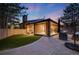 Backyard patio with stylish seating, green grass, and brick exterior, perfect for outdoor living at 2777 S Elmira St # 17, Denver, CO 80231