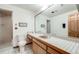 Classic bathroom featuring a vanity with ceramic tile and a glass enclosed walk-in shower at 2777 S Elmira St # 17, Denver, CO 80231