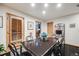 A dining room with a view of a blue flower centerpiece and a wooden door at 2777 S Elmira St # 17, Denver, CO 80231