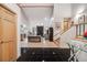 Elegant foyer with black tile flooring leading to a spacious living area with a fireplace at 2777 S Elmira St # 17, Denver, CO 80231