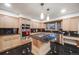 Modern kitchen with stainless steel appliances and a black countertop island with cooktop at 2777 S Elmira St # 17, Denver, CO 80231