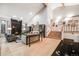 Spacious living room with a fireplace, high ceilings, and a staircase at 2777 S Elmira St # 17, Denver, CO 80231
