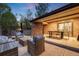 Outdoor patio with a dining table, wicker sofa, and accent chairs, perfect for entertaining at 2777 S Elmira St # 17, Denver, CO 80231