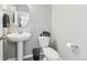 Small bathroom with pedestal sink and toilet at 21795 E 8Th Ave, Aurora, CO 80018