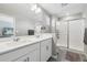 Modern bathroom with double vanity and a large shower at 21795 E 8Th Ave, Aurora, CO 80018