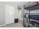 Bedroom with a bunk bed and a view of the laundry room at 21795 E 8Th Ave, Aurora, CO 80018