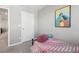 Bright bedroom with twin bed and access to hallway at 21795 E 8Th Ave, Aurora, CO 80018