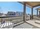 Covered front porch with railing overlooks the neighborhood at 21795 E 8Th Ave, Aurora, CO 80018