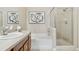 Bright bathroom featuring a bathtub, shower, and modern vanity with stylish decor for a relaxing and luxurious feel at 10176 Park Meadows Dr # 2408, Lone Tree, CO 80124