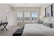 Bedroom featuring bright windows, gray nightstands, and a sleek, neutral decor at 10176 Park Meadows Dr # 2408, Lone Tree, CO 80124