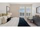 Inviting bedroom featuring a cozy chair, dresser, and great natural light at 10176 Park Meadows Dr # 2408, Lone Tree, CO 80124