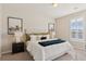 Serene bedroom with king bed, stylish decor, and ample natural light at 10176 Park Meadows Dr # 2408, Lone Tree, CO 80124