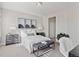Cozy bedroom with neutral tones, a plush bed, modern nightstands, and stylish artwork for a serene atmosphere at 10176 Park Meadows Dr # 2408, Lone Tree, CO 80124