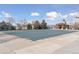 A refreshing community pool with a safety cover and adjacent outdoor kitchen offers a perfect space for relaxation at 10176 Park Meadows Dr # 2408, Lone Tree, CO 80124