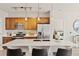 Modern kitchen with stainless steel appliances, breakfast bar, and view to bedroom at 10176 Park Meadows Dr # 2408, Lone Tree, CO 80124