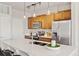 Beautiful kitchen featuring stainless steel appliances, large island, and modern finishes at 10176 Park Meadows Dr # 2408, Lone Tree, CO 80124