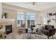 Cozy living room with a fireplace, comfortable seating, and ample natural light at 10176 Park Meadows Dr # 2408, Lone Tree, CO 80124
