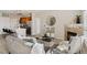 Bright living room showcasing an open floor plan, a cozy fireplace, and modern kitchen with a breakfast bar at 10176 Park Meadows Dr # 2408, Lone Tree, CO 80124