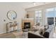 Elegant living room with fireplace, stylish furniture, and a view of the outdoors at 10176 Park Meadows Dr # 2408, Lone Tree, CO 80124