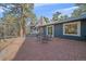 The backyard patio features brick pavers and an outdoor seating area at 638 Kinnikinnik Hl, Golden, CO 80401