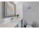 Clean bathroom with a modern mirror, sink, and toilet at 638 Kinnikinnik Hl, Golden, CO 80401