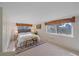 Light-filled bedroom with large windows and simple elegant décor at 638 Kinnikinnik Hl, Golden, CO 80401