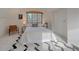 Bright bedroom with large windows, a peaked ceiling, and a modern rug at 638 Kinnikinnik Hl, Golden, CO 80401