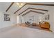 Spacious living room with a vaulted ceiling, hardwood floors, and ample natural light at 638 Kinnikinnik Hl, Golden, CO 80401
