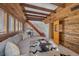 Comfortable living room with wood paneled walls and staircase at 638 Kinnikinnik Hl, Golden, CO 80401