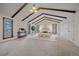 Bright main bedroom with vaulted ceilings, hardwood floors, large windows and seating at 638 Kinnikinnik Hl, Golden, CO 80401