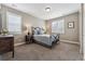 Serene bedroom with soft lighting, shuttered windows, and a stylish metal bed frame at 4937 Hogback Ridge Rd, Morrison, CO 80465