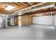 Unfinished basement space with exposed wood framing and mechanical systems at 23612 E Mississippi Cir, Aurora, CO 80018