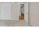 Neutral carpeted bedroom with double closet with view to hallway at 23612 E Mississippi Cir, Aurora, CO 80018