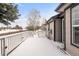 View from deck showcases house with white railing covered in snow at 23612 E Mississippi Cir, Aurora, CO 80018