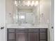 Modern bathroom with double vanity and a large mirror at 12224 Olive Way, Thornton, CO 80602