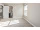 Bright bedroom with carpet flooring and an ensuite bathroom at 12224 Olive Way, Thornton, CO 80602